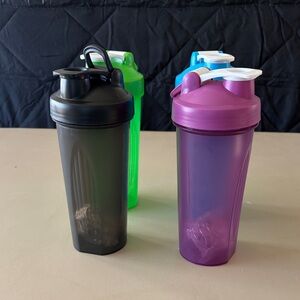 Set of 4 Plastic Shaker Bottles in Black, Blue Purple, and Green